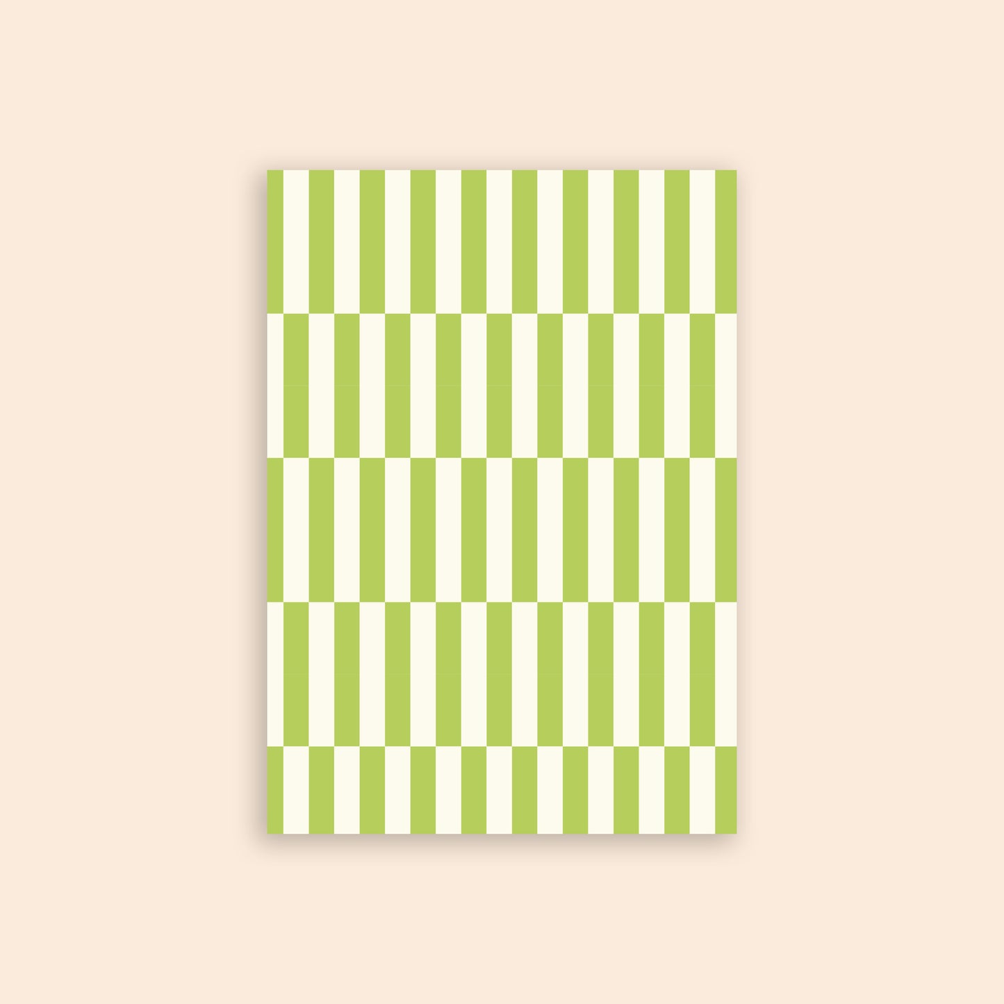 Green and white checkerboard craft paper in front of a beige background.