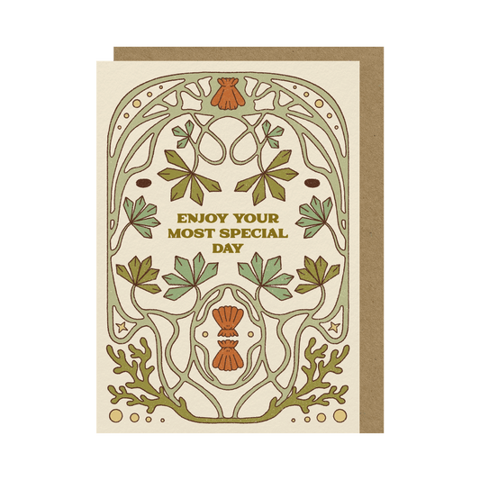 Greeting card and brown envelope on a transparent background. The card has an under the sea, art-nouveau inspired  symmetrical illustration.