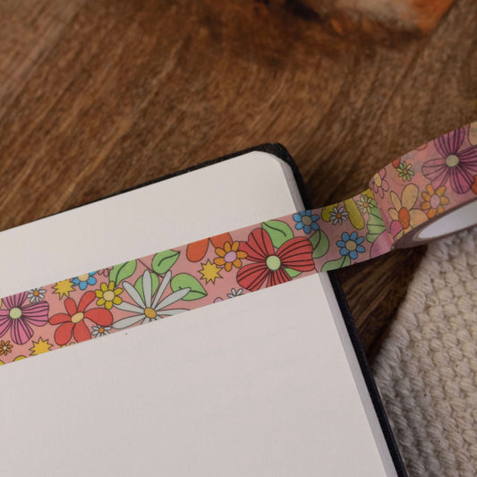 a floral washi tape stuck in a notepad.