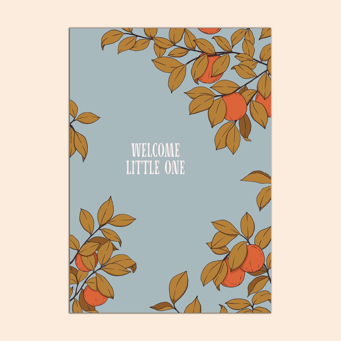 Greeting Card with orange tree design on a light blue background with 'Welcome Little One' text, the card is in front of a light beige background.