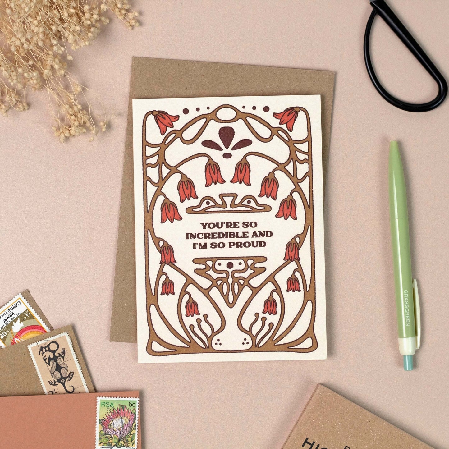 Greeting card with decorative design and text reading 'You're so Incredible and I'm So Proud' on a beige background